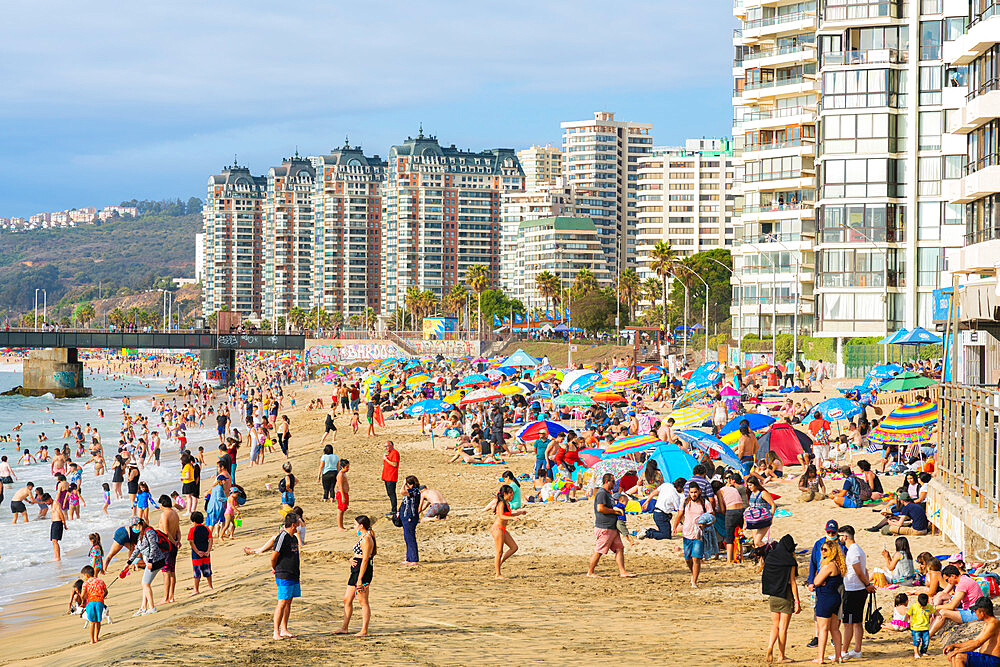 People relaxing on Acapulco Beach near Vergara Pier, Vina del Mar, Chile