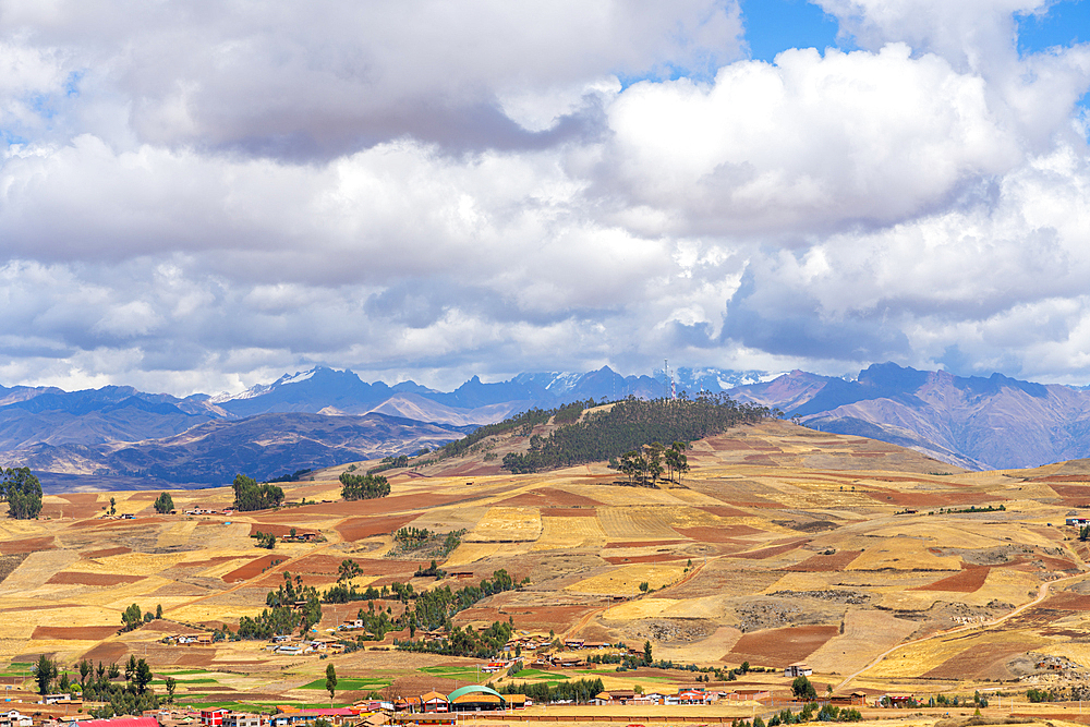 Fields around Racchi village near Chinchero with distant views of Andes mountains, Sacred Valley, Peru