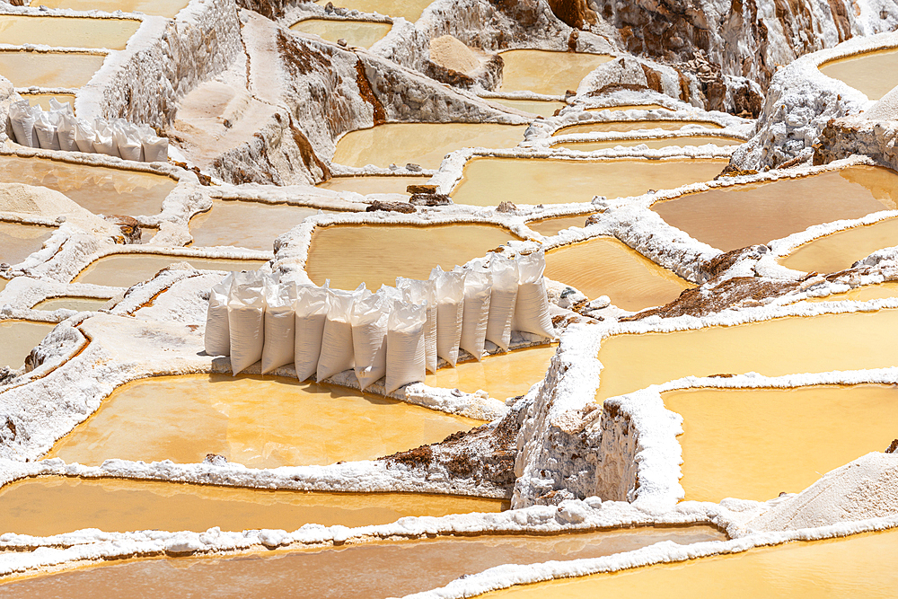 Sacks of salt at salt mines of Maras, Salinas de Maras, Cuzco Region, Peru