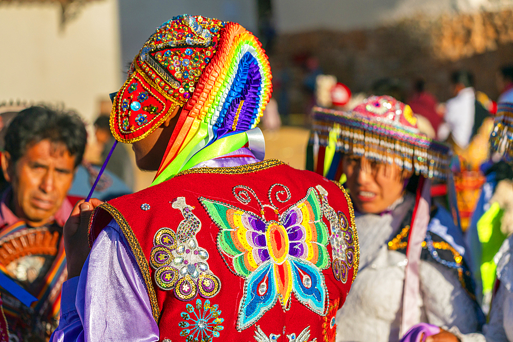 Back view of Peruvian man in traditional dress on celebration, Chinchero, Peru, South America