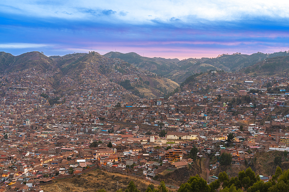 Elevated view of Cusco at dusk, UNESCO World Heritage Site, Cusco Region, Peru, South America