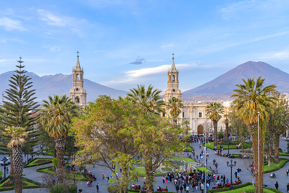 El Misti and Chachani volcanos rising above Basilica Cathedral of Arequipa at Plaza de Armas Square, UNESCO, Arequipa, Peru