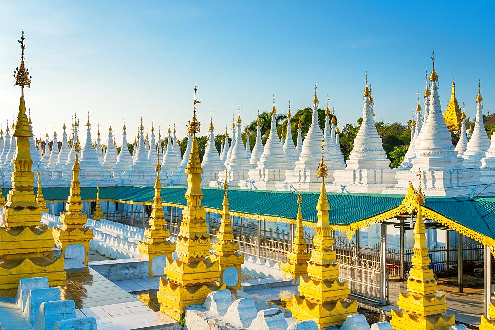 White pagodas at Sanda Muni pagoda, Mandalay, Myanmar