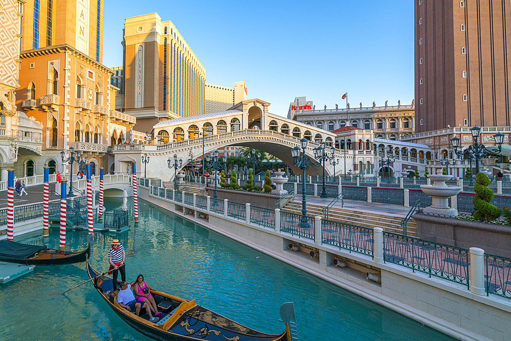 Gondola rides in canal The Venetian Las Vegas Hotel at sunset, Las Vegas Strip, Paradise, Las Vegas Boulevard, Las Vegas, Nevada, USA