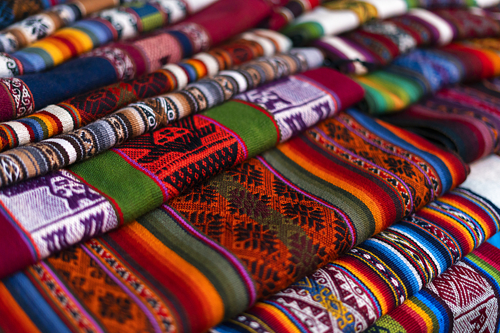 Fabrics at market, Pisaq, Sacred Valley, Cusco, Peru, South America