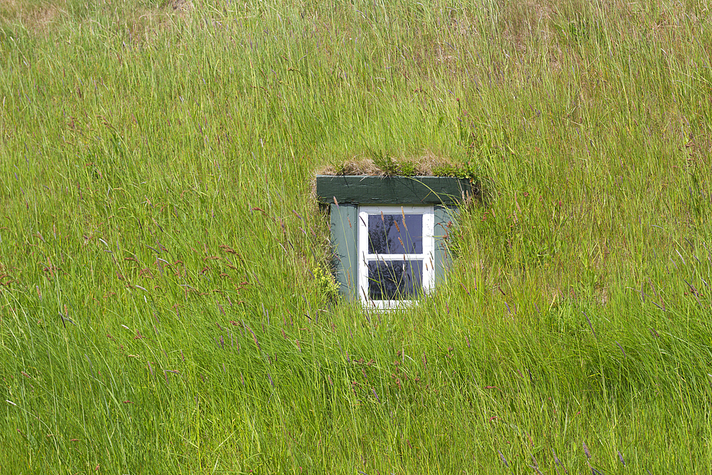 Detail of window of grass-covered roof of historic Hofskirkja church in Hof village, South Iceland, Iceland, Polar Regions