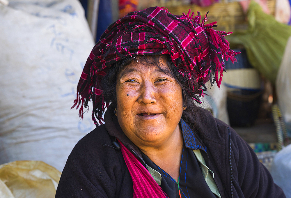 Portrait of woman with traditional headwear, Inn Thein market, Lake Inle, Shan State, Myanmar (Burma), Asia