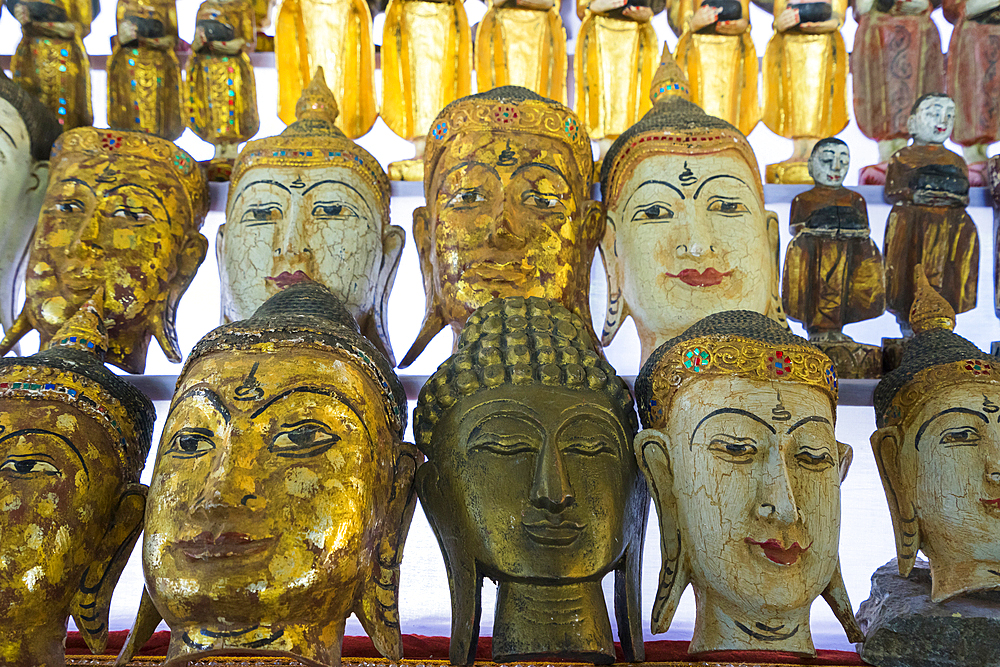 Buddha masks on display at shop, Mandalay, Myanmar (Burma), Asia