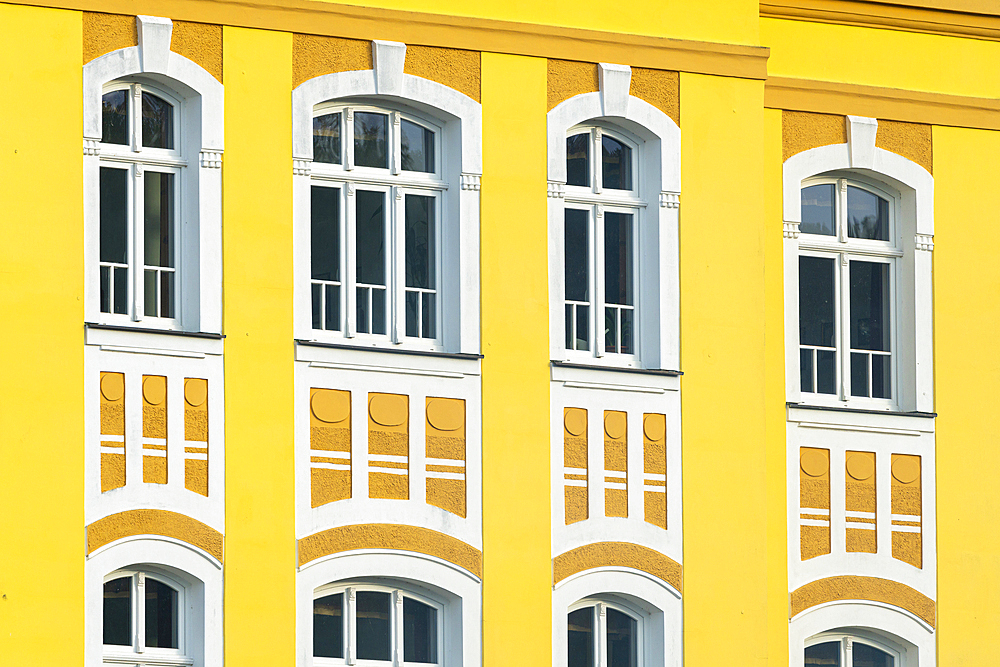 Detail of yellow facade of Svaty Florian (St. Florian) family brewery, Loket, Czech Republic (Czechia), Europe