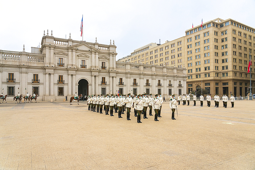 Policemen performing changing of guards ceremony in front of La Moneda Palace, Santiago, Santiago Metropolitan Region, Chile, South America