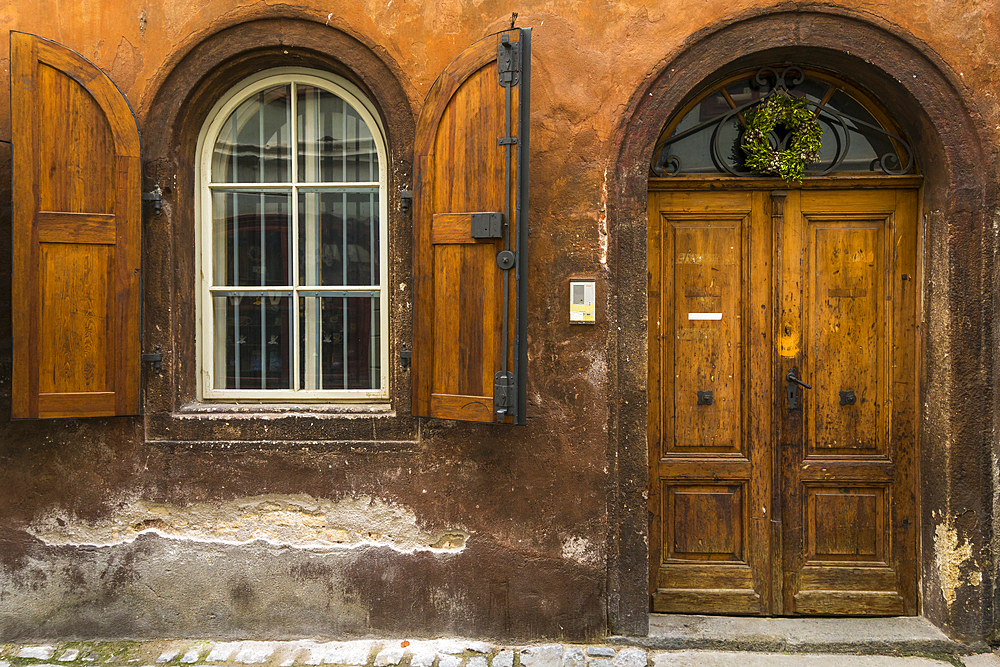 Facade of house with arched window and wooden door in historical center, UNESCO World Heritage Site, Cesky Krumlov, Czech Republic (Czechia), Europe