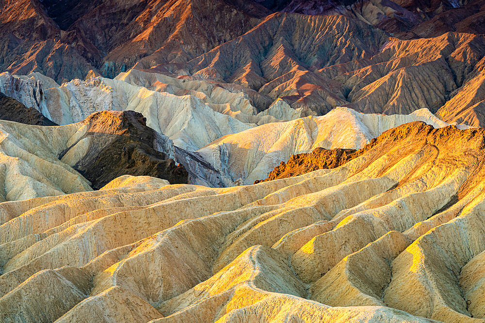 Full frame abstract shot of natural rock formations at Zabriskie Point at sunrise, Death Valley National Park, California, USA