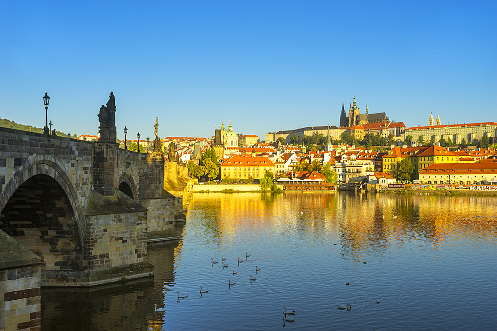 Prague Castle and Charles Bridge on Vltava River in city at sunrise, UNESCO World Heritage Site, Prague, Bohemia, Czech Republic (Czechia), Europe