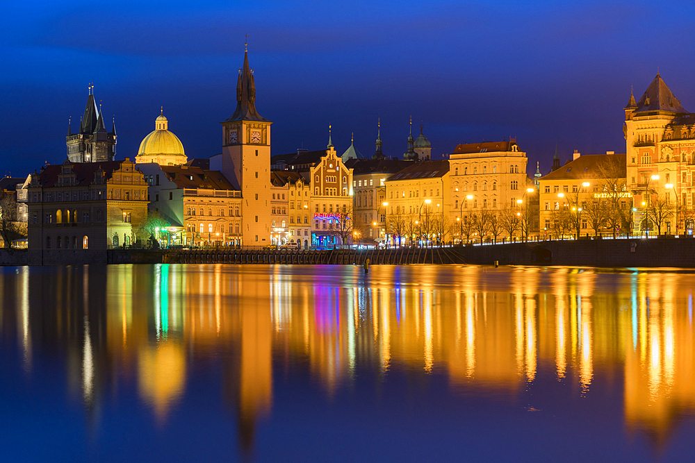 Reflection of Bedrich Smetana Museum and Old Town Waterworks at Smetanovo nabrezi at night, Prague, Bohemia, Czech Republic (Czechia), Europe