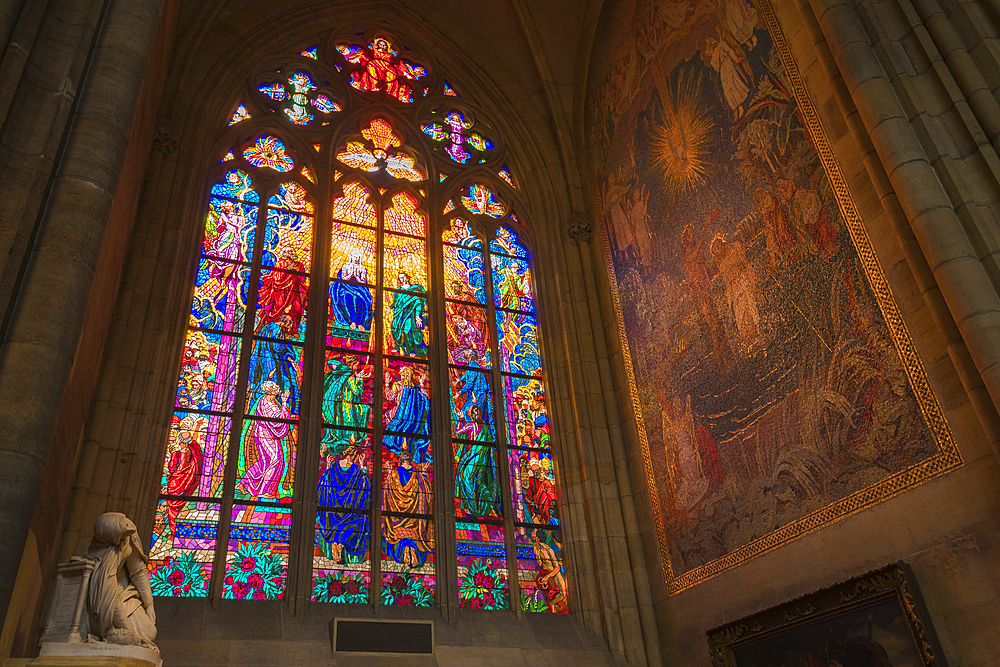 Low angle view of stained glass windows at St. Vitus Cathedral, UNESCO World Heritage Site, Prague, Bohemia, Czech Republic (Czechia), Europe