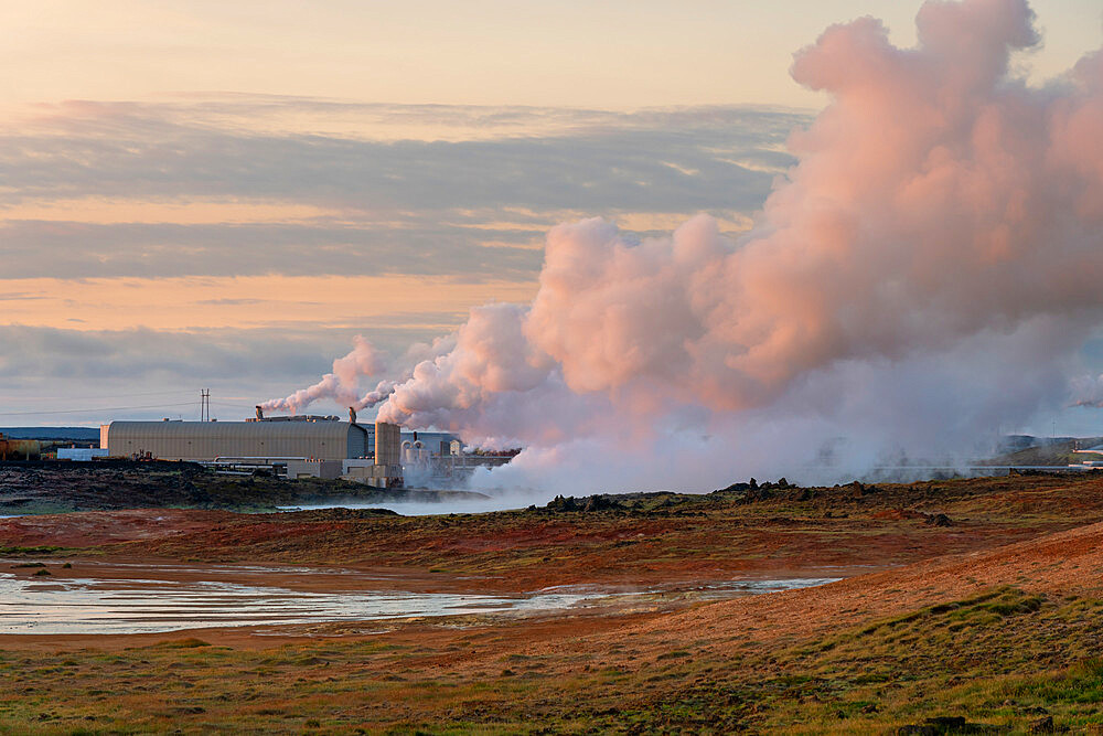 Geothermal Reykjanes power plant and smoking fumarole at Gunnuhver hot spring, Reykjanes Peninsula, Iceland