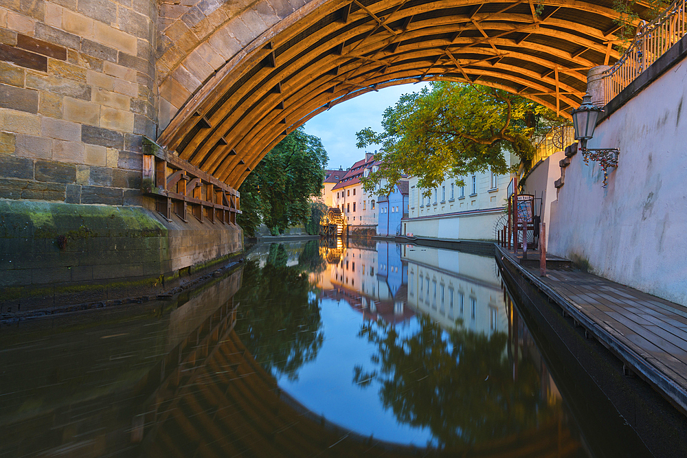 Reflections in Devil's Channel (Certovka) under Charles Bridge, Prague, Bohemia, Czech Republic (Czechia), Europe