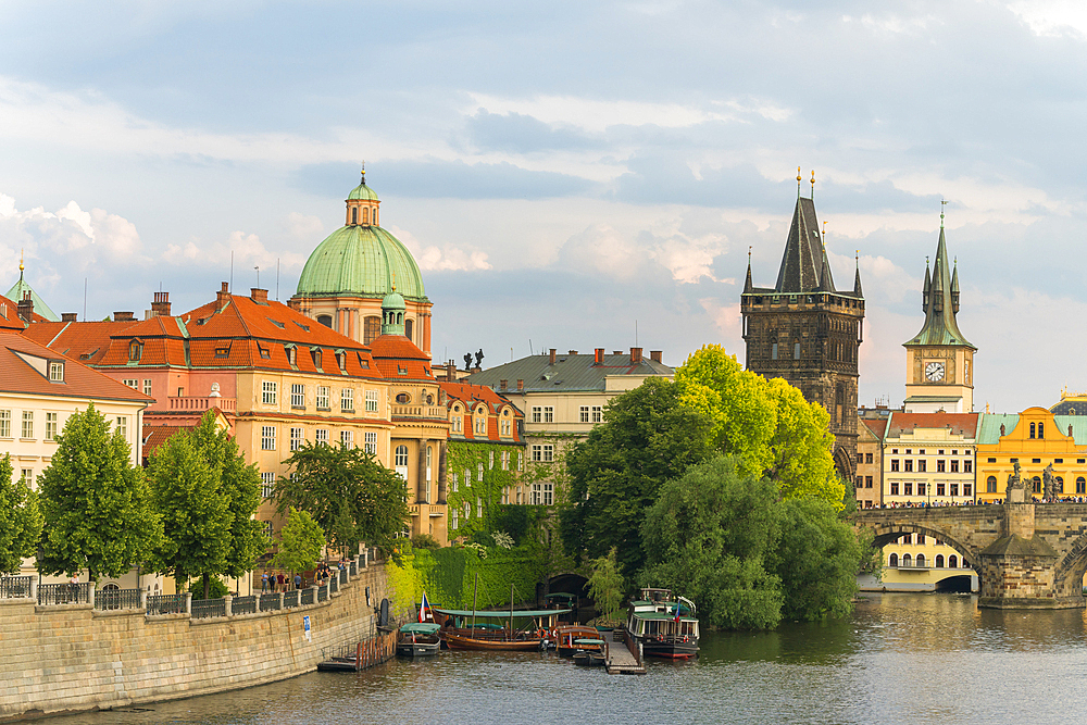 Charles Bridge and Church of Saint Francis of Assisi with Old Town Bridge Tower against sky, UNESCO World Heritage Site, Prague, Bohemia, Czech Republic (Czechia), Europe