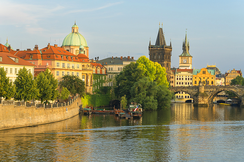 Charles Bridge and Church of Saint Francis of Assisi with Old Town Bridge Tower against sky, UNESCO World Heritage Site, Prague, Bohemia, Czech Republic (Czechia), Europe