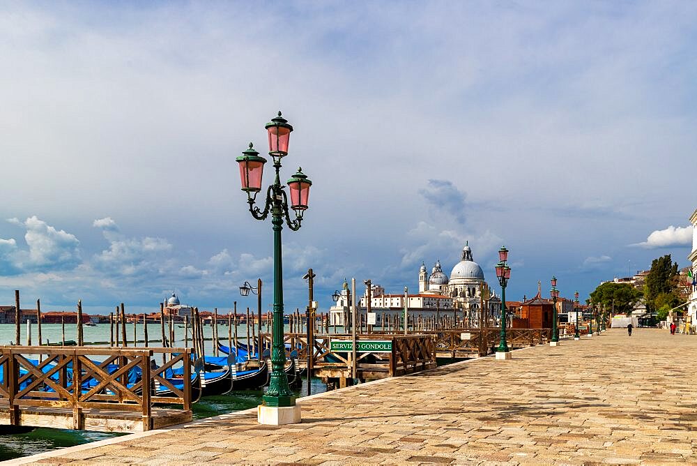 The Riva degli Schiavoni with its typical green street lamps and gondolas moorings, Venice, Veneto, Italy