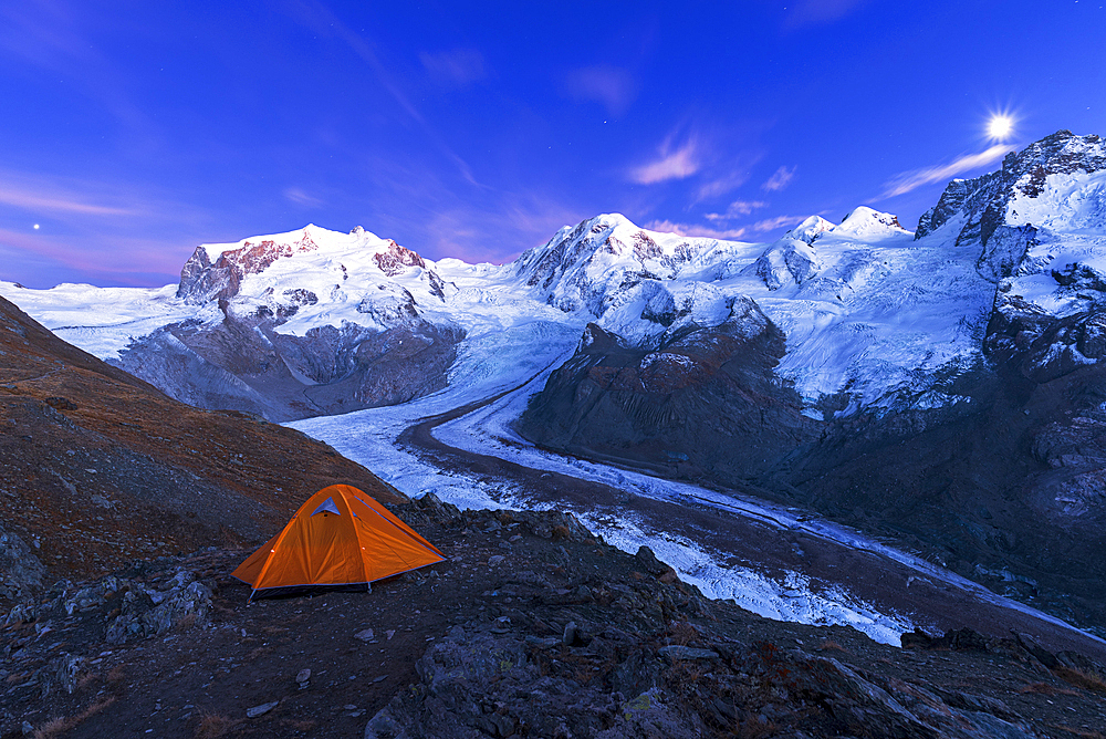 View of the Swiss side of Monte Rosa massif and Gorner glacier (Gornergletscher) with majestic Lyskamm peaks seen from Riffelsee Lake at dusk, Zermatt, Canton of Valais, Visp, Switzerland, Europe