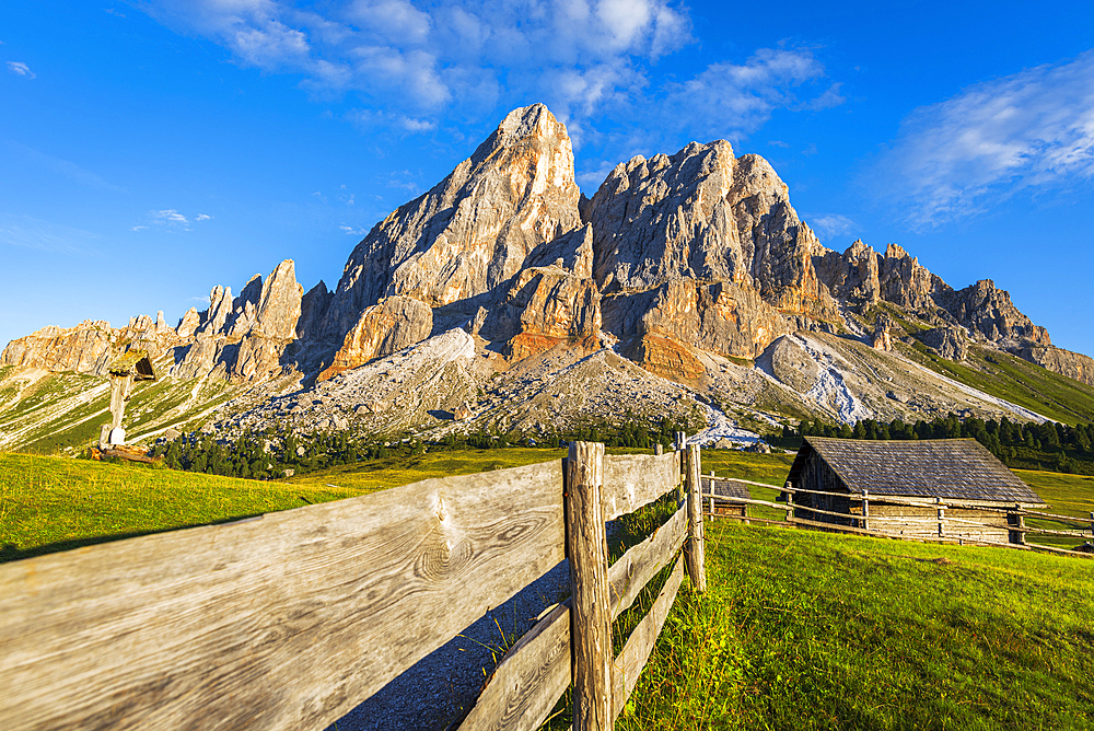 Mountain hut in green meadows under the massif of Sass de Putia at sunset, Passo delle Erbe, Dolomites, Puez Odle, Bolzano district, South Tyrol, Italy, Europe