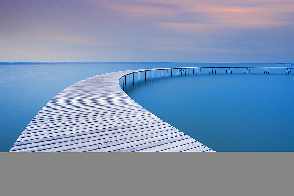 The circle shaped wooden bridge (Infinity Bridge) at dusk, Aarhus, Jutland region, Denmark, Europe