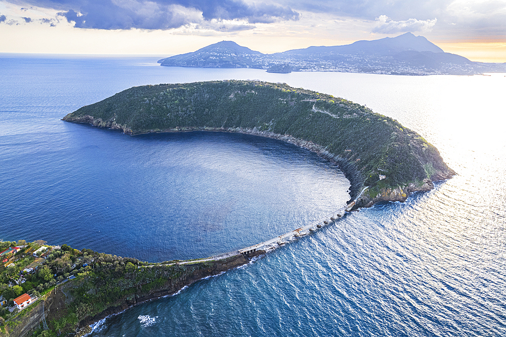 Aerial view of the island of Vivara, the ancient volcano crater collapsed, with Ischia island's mountains in the background, Tyrrhenian Sea, Naples district, Naples Bay, Campania region, Italy, Europe