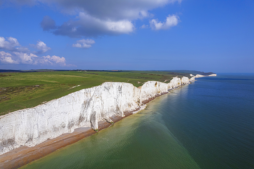 Aerial view of the Seven Sisters chalk white cliffs on a sunny day, South Downs National Park, East Sussex, England, United Kingdom, Europe