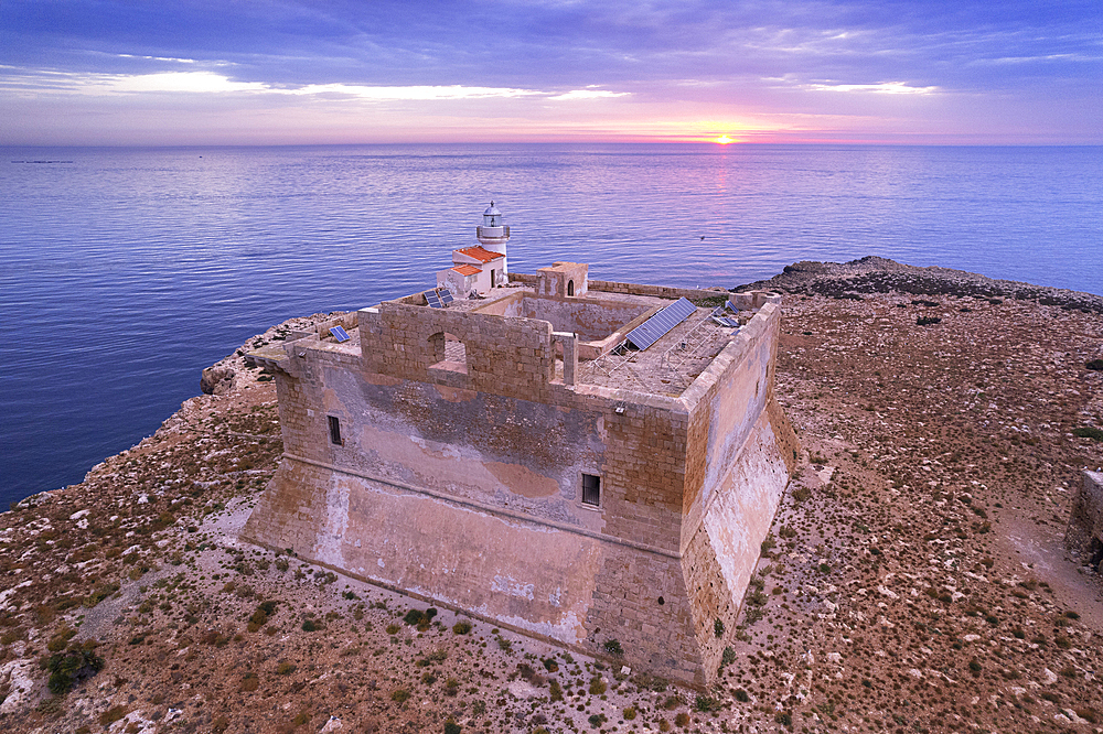 Aerial view of the fortified tower with the light house built on top of Capo Passero island at sunrise, Capo Passero island, Portopalo di Capo Passero municipality, Siracusa province, Sicily, Italy, Mediterranean, Europe