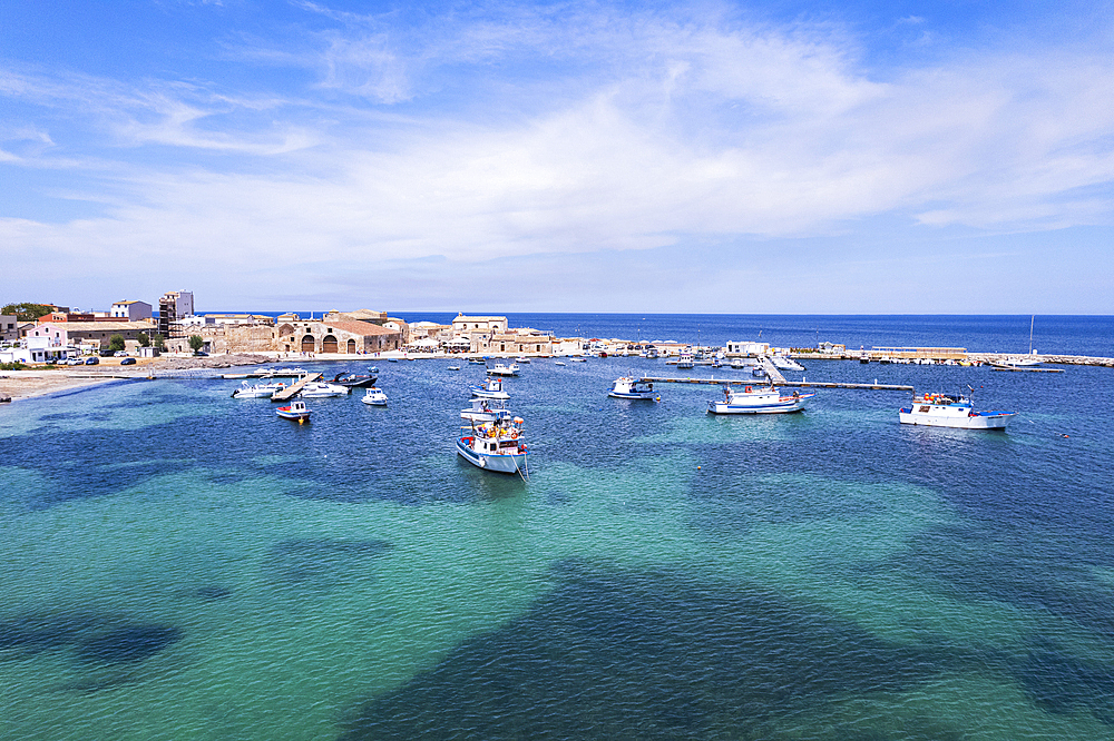 Aerial view of the harbour of the fishing village of Marzamemi with fishing boats floating in turquoise waters, Marzamemi, Pachino municipality, Siracusa province, Sicily,  Italy, Mediterranean, Europe