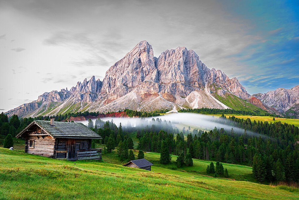 Mountain huts among green woods with fog in the morning, Sass De Putia, Passo delle Erbe, Dolomites, South Tyrol, Italy, Europe