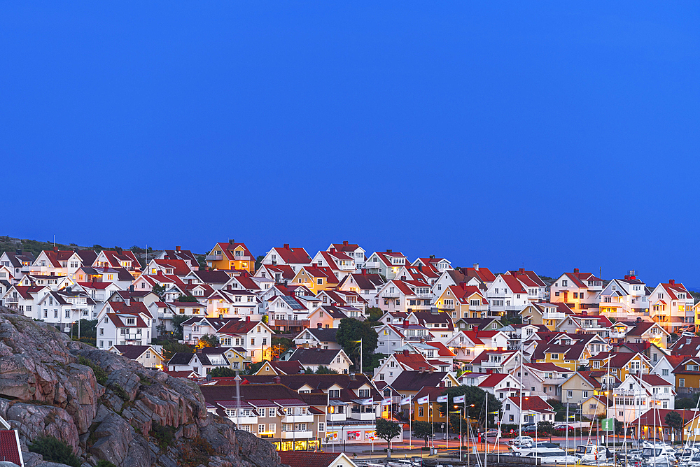 Traditional illuminated village of Kungshamn at dusk, Bohuslan, Vastra Gotaland, West Sweden, Sweden, Scandinavia, Europe