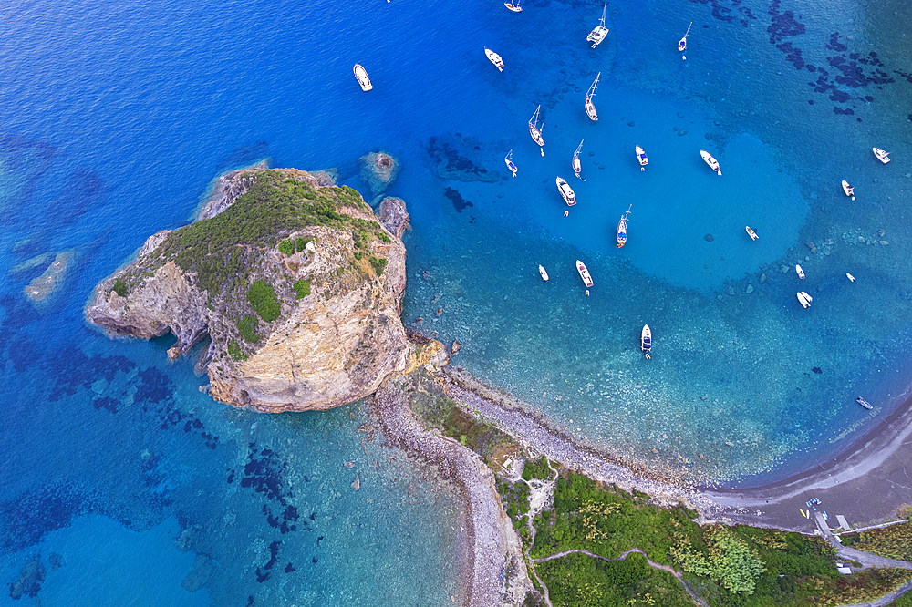 Aerial view of the cliff of Saint Silverio with boats anchored in Francese Bay, Palmarola island, Ponza municipality, Tyrrhenian Sea, Pontine archipelago, Latina Province, Latium (Lazio), Italy, Europe