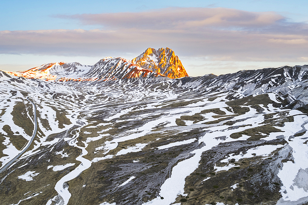 Aerial view of Campo Imperatore plateau during spring thaw at dawn, Gran Sasso and Monti della Laga National Park, L'Aquila province, Abruzzo, Italy, Europe