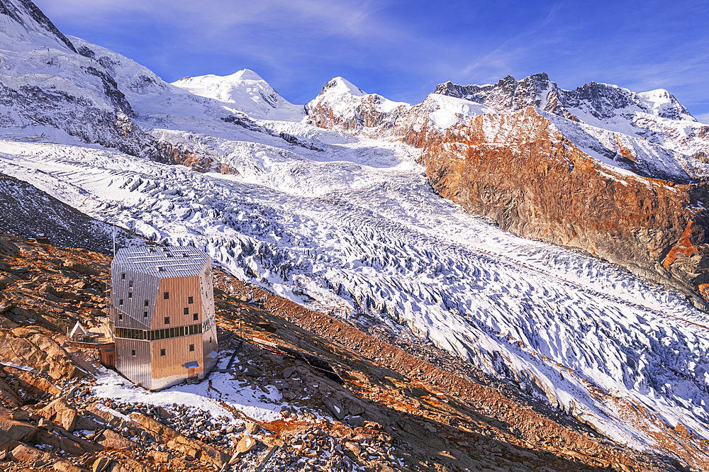 View of the Monte Rosa hut on top of a Gorner Glacier with Mount Rosa peaks in the background, morning view, Zermatt, Valais canton, Switzerland, Europe