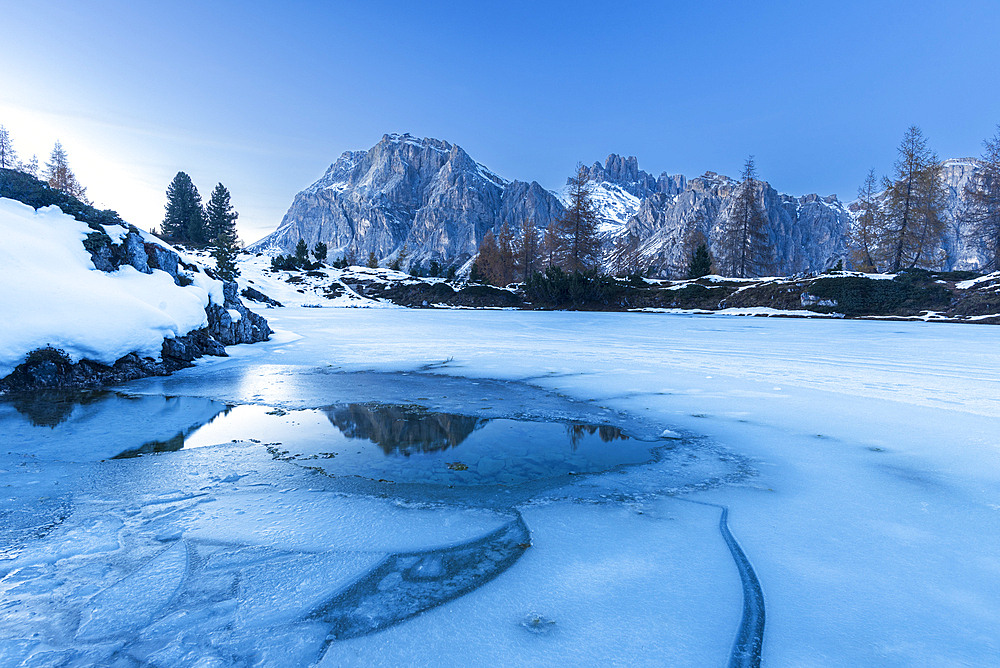 Dusk on the frozen lake of Limides, Falzarego mountain pass, Dolomites, South Tyrol, Italy, Europe