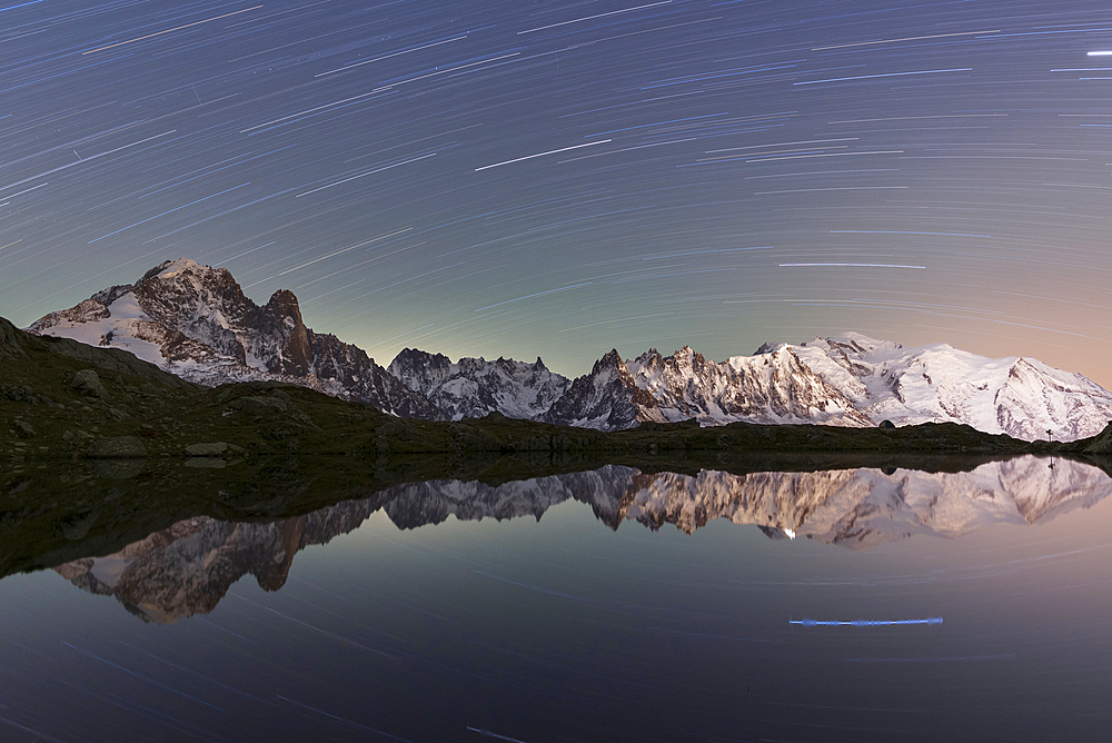 Star trail over Mont Blanc range seen from Lac de Cheserys, Chamonix, French Alps, Haute Savoie, France, Europe