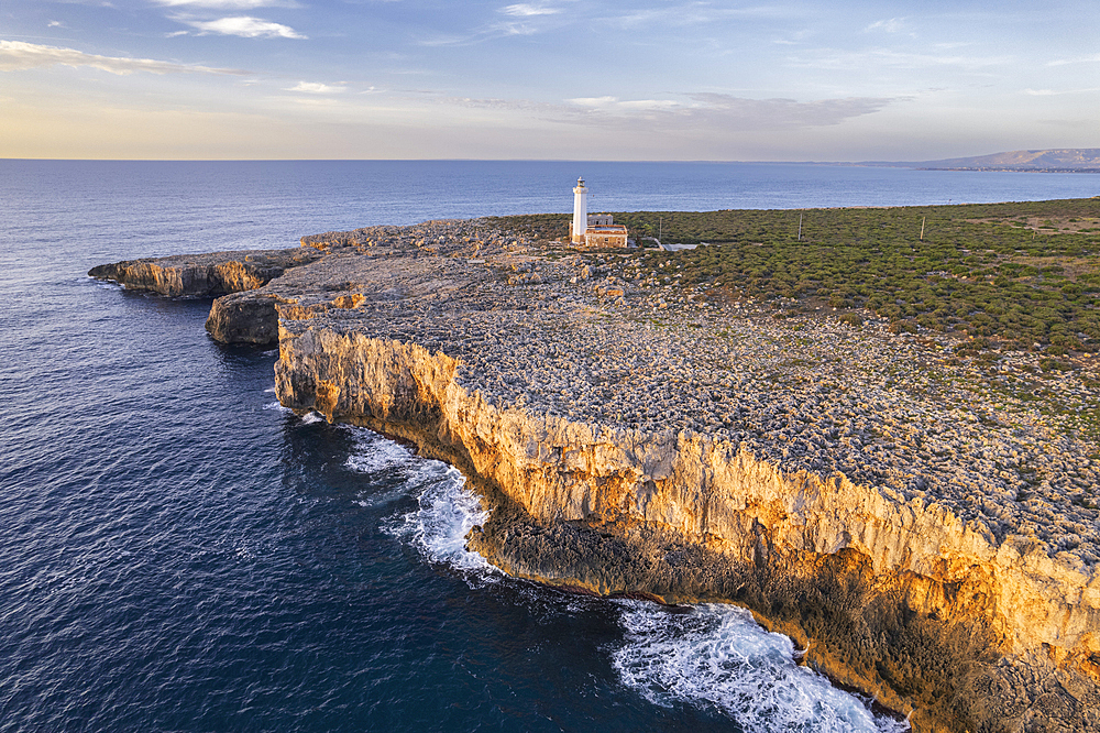 Aerial morning view of the white lighthouse of Capo Murro di Porco on the peninsula Maddalena, Plemmirio Marine Park, Ionian Sea, Syracuse province, Sicily, Italy, Mediterranean, Europe