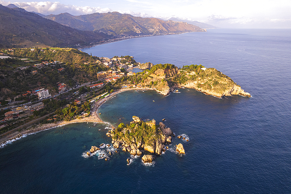 Aerial view of the Sicilian rocky shoreline of Taormina municipality with Isola Bella in the foreground, Taormina, Ionian sea, Mediterranean sea, Messina province, Sicily, Italy, Mediterranean, Europe