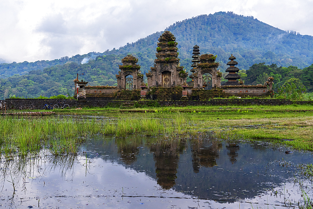 Reflection of the temple Ulun Danu Tamblingan in the water of the lake, Munduk, Bali, Indonesia, Southeast Asia, Asia