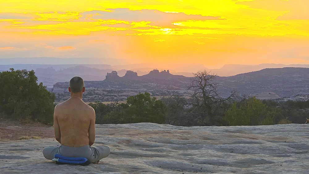 Meditation at sunrise, Canyonlands National Park, Utah, USA