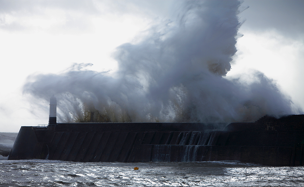 Storm waves over Porthcawl Pier, Porthcawl, South Wales, United Kingdom, Europe