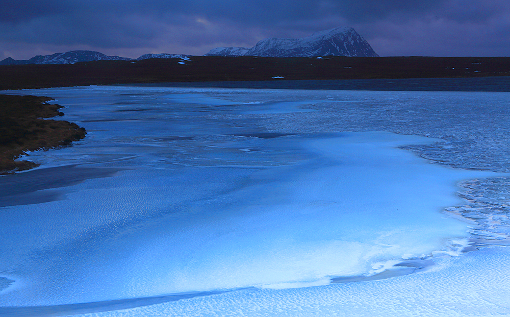 Ben Hope and iced lochan at dusk, Sutherland, Highlands, Scotland, United Kingdom, Europe