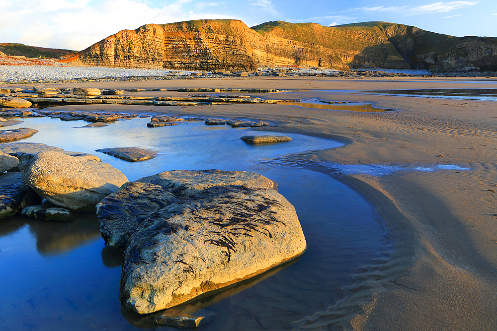 Limestone cliffs and beach, Dunraven Bay, Southerndown, Vale of Glamorgan, South Wales, United Kingdom