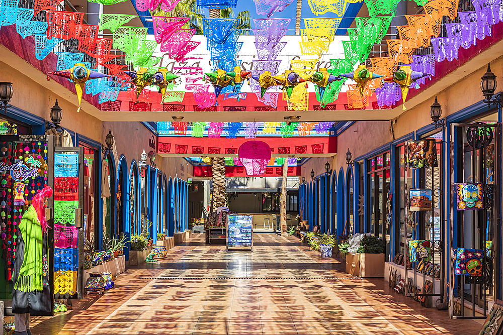 Loreto, Baja California Sur, Mexico. November 17, 2021. Colorful banners over a market in Loreto.