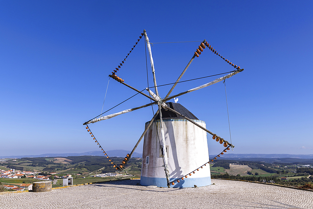 Europe, Portugal, Moita dos Ferreiros.  Moinhos de Ventos. windmills Traditional Clay pots, jugs, used to catch the winds.