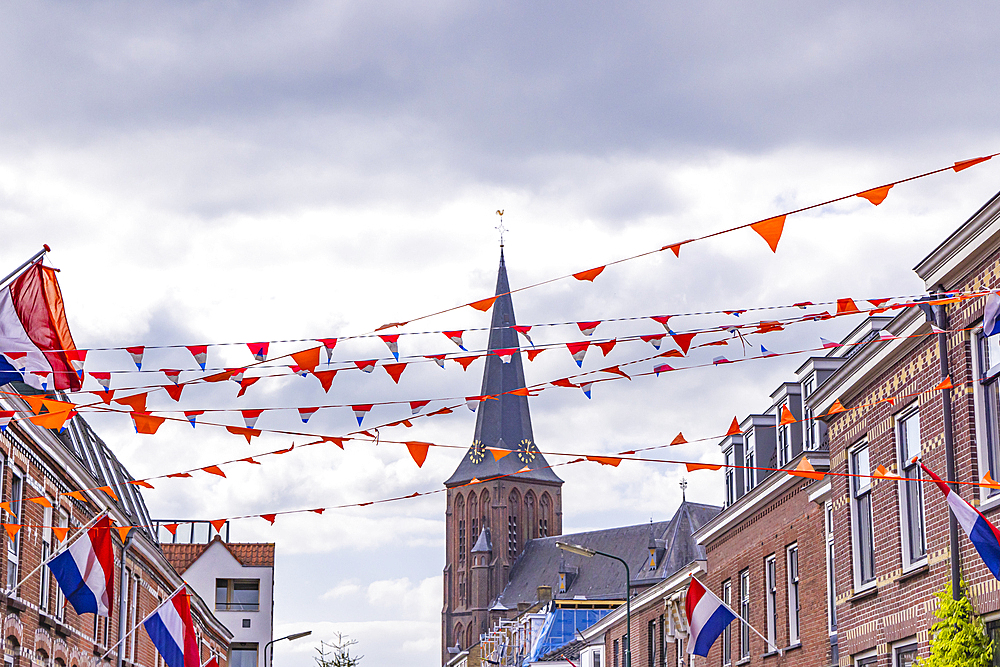 Europe, Netherlands, Utrecht, Maarssen. Flags and banners put up for the King's Day celebrations in Maarssen.