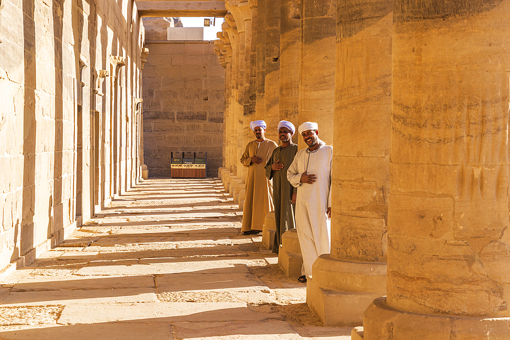 Agilkia Island, Aswan, Egypt. February 24, 2022. Guides between columns at Philae Temple, a UNESCO World Heritage Site.