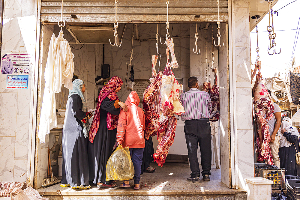 Thebes, Luxor, Egypt. February 24, 2022. Cow carcasses hanging at a butcher shop in Luxor.